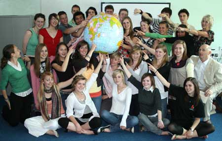 Travel Scholars holding Globe